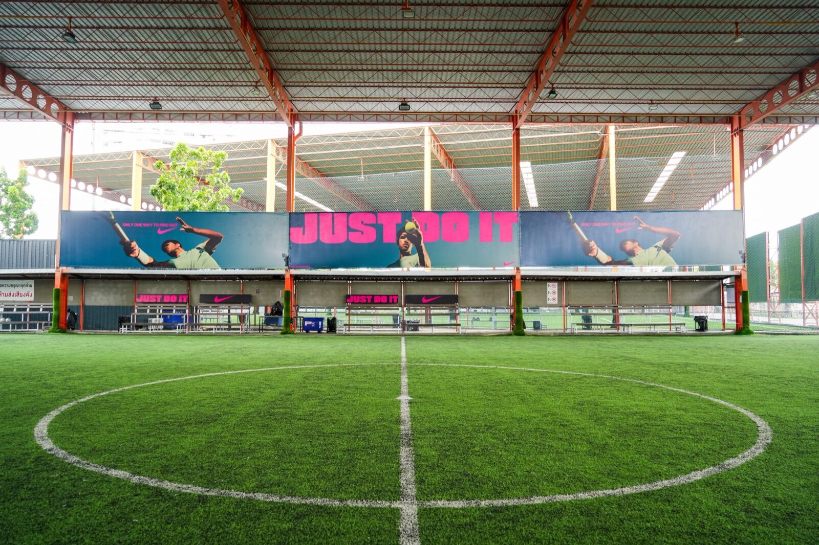 Nike JUST DO IT takeover wrapping a floodlit five-a-side futsal pitch