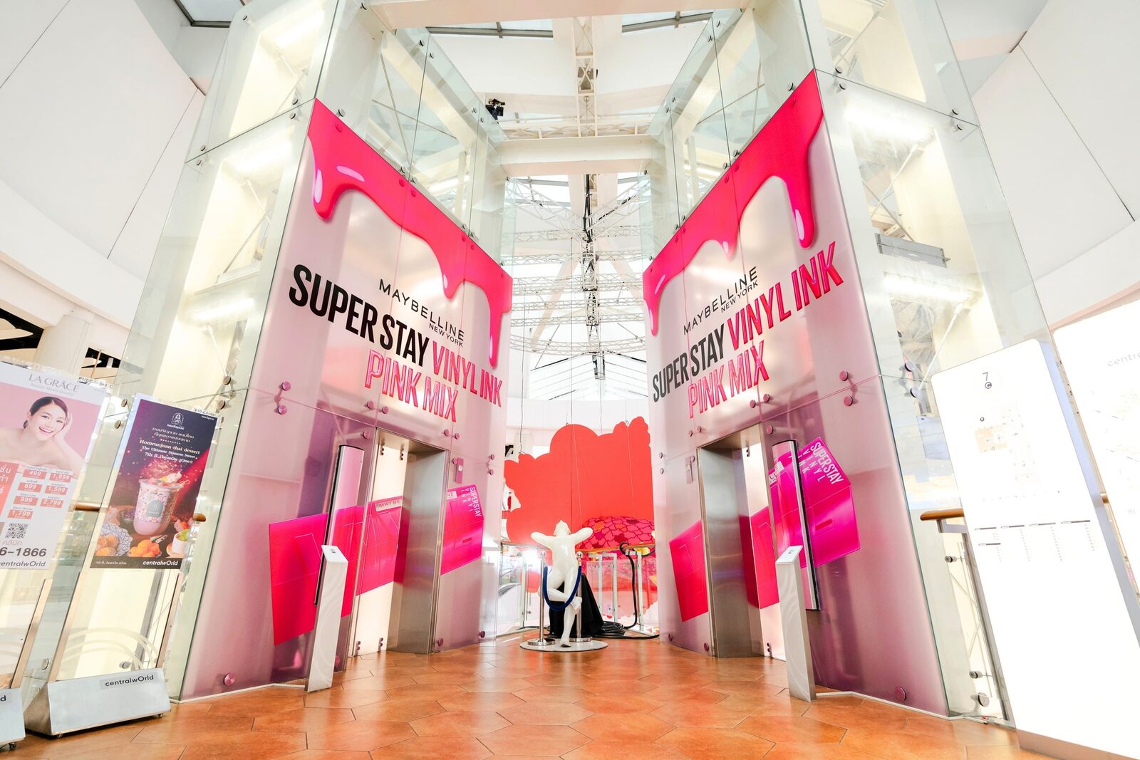 Maybelline Super Stay hot-pink dripping-paint mall takeover installation